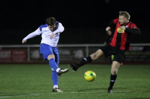Enfield's Lewis Taaffe shoots as James Hammond tries to block