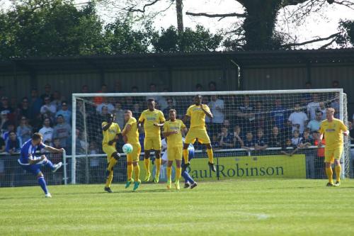 Billericays Billy Bricknell curls a free kick against the defensive wall