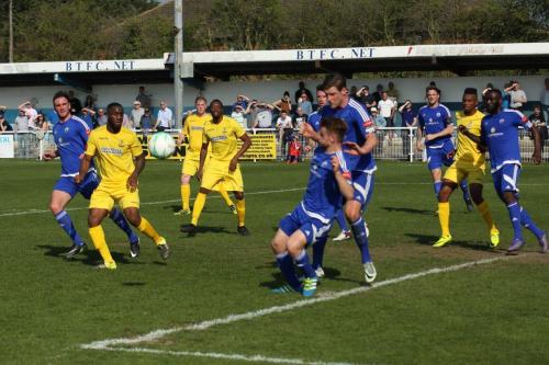 Billericays Byron Lawrence clears at a set piece