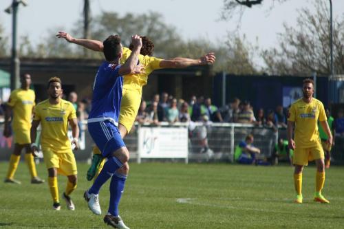 Billericays Joe Ellul (blue) challenges Harry Ottaway