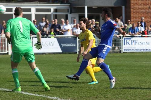 Billericays Joe Ellul (blue) clears from Harry Ottaway