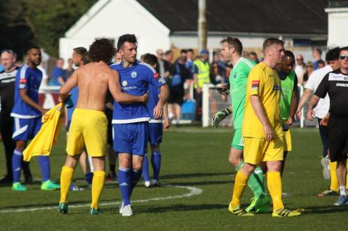 Billericays Joe Ellul (blue) congratulates Harry Ottaway at the final whistle