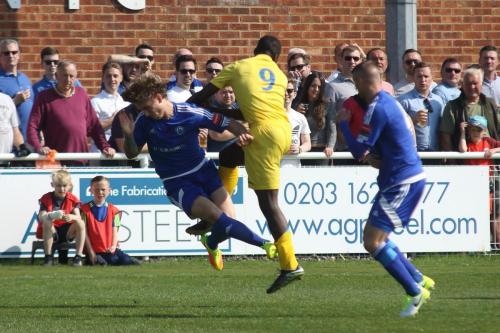 Billericays Ollie Sprague (L) challenges Percy Kiangebeni