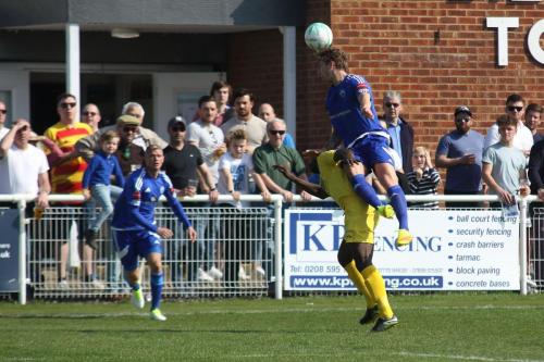 Billericays Ollie Sprague wins a header against Percy Kiangebeni