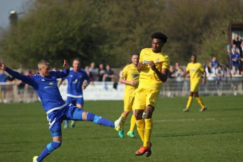 Billericays Paul Konchesky (L) stretches to knock the ball away from Dernell Wynter