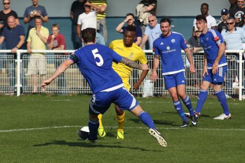 Billericays Rob Swaine (5) challenges Karl Oliyide