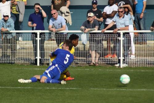 Billericays Rob Swaine (5) earns a yellow card for a rugby tackle on Dernell Wynter