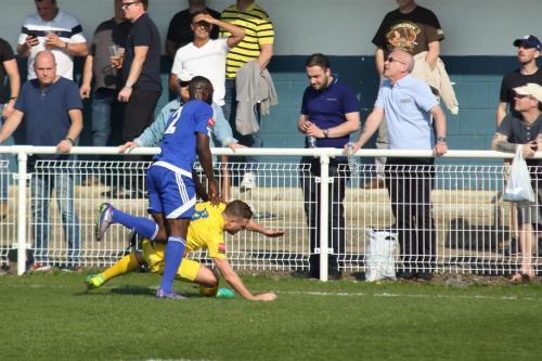 Billericays Tambeson Eyong concedes a free kick for a needless push on Billy Crook