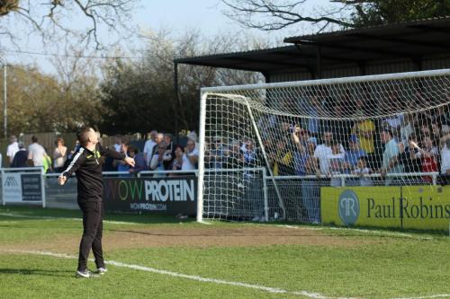 Enfield manager Brad Quinton salutes the travelling fans78