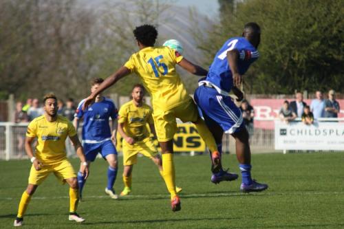 Enfields Dernell Wynter (15) challenges Tambeson Eyong
