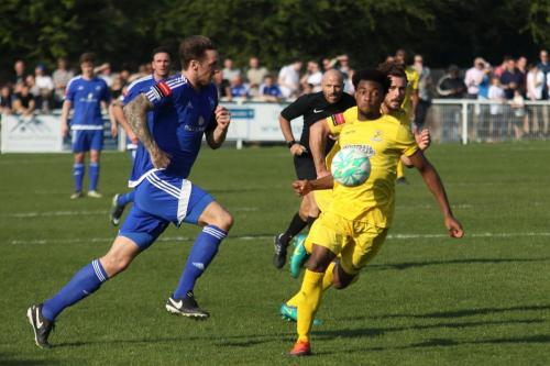 Enfields Dernell Wynter (yellow) and Billericays Rob Swaine