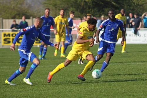 Enfields Dernell Wynter runs between Paul Konchesky (L) and Tambeson Eyong