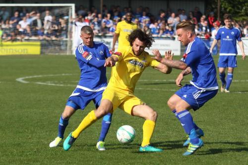 Enfields Harry Ottaway challenged by Paul Konchesky (R) and Jamie OHara