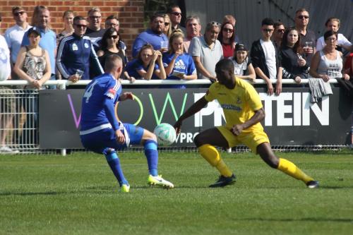 Enfields Percy Kiangebeni (R) tries to beat Paul Konchesky on the outside