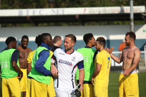 Enfields goalkeeper captain Nathan McDonald celebrates with Percy Kiangebeni