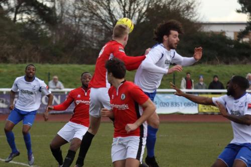 Burgess Hills James Richmond (red) beats Harry Ottaway in the air