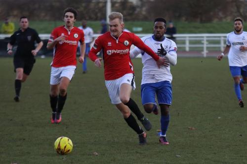 Burgess Hills James Richmond (red) holds off Bobby Devyne