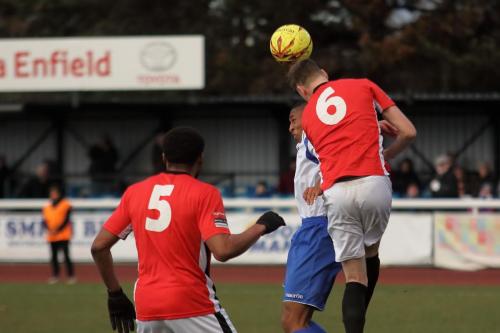 Burgess Hills Sam Fisk (6) heads clear from Jonathan Muleba