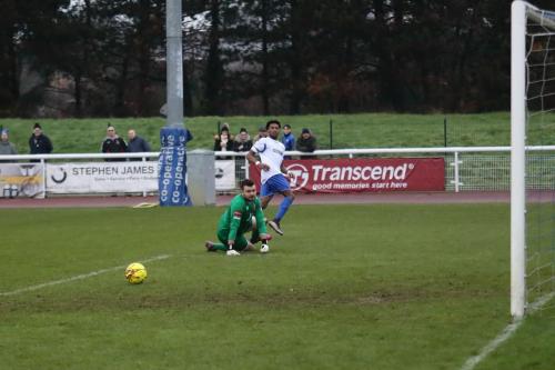 Dernell Wynter rolls a shot past Sudbury keeper Marcus Garnham but wide of the post