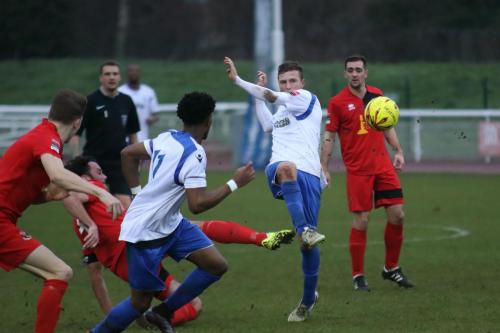 Enfields Billy Crook (white, R) plays the ball to Dernell Wynter
