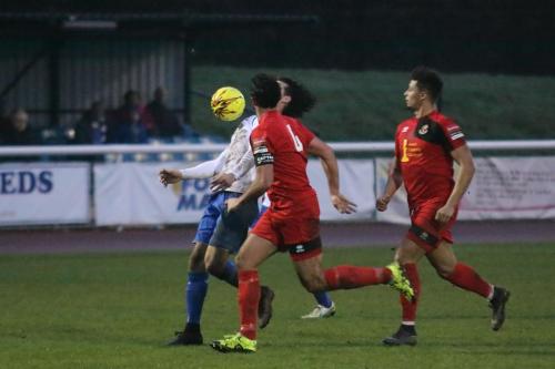 Enfields Harry Ottaway chests the ball down under pressure from James Baker