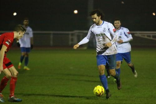 Enfields Harry Ottaway runs at Tyler French