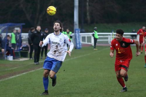 Enfields Harry Ottaway watches the ball as Aidan Austin tries to catch up