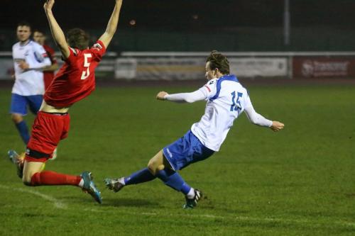 Enfields Mickey Parcell shoots as Tyler French tries to block