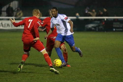 Enfields Ricky Gabriel runs at Sam Bantick