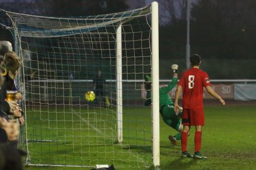 Sudburys Dylan Williams (8) and keeper Marcus Garnham watch as a header flies wide of the far post