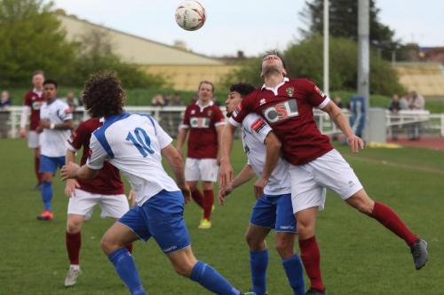 Bognors Alex Parsons (R) challenges Samir Bihmoutine