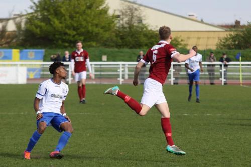 Bognors Chad Field (R) heads clear from Dernell Wynter