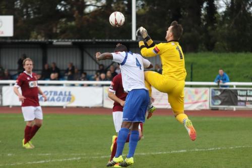 Bognors Dan Lincoln punches clear from Harold Joseph