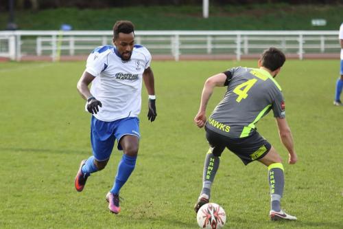 Bobby Devyne (L) plays the ball through the legs of Havants Brian Stock