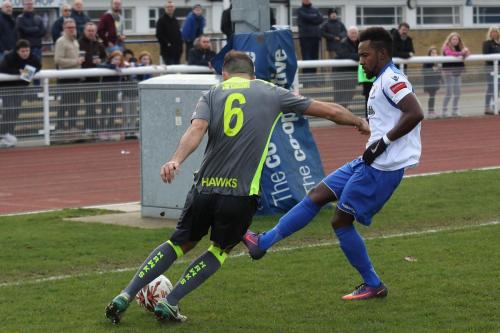 Bobby Devyne (R) tries to block a clearance from Havants Ed Harris