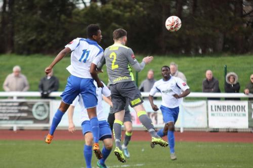 Enfields Karl Oliyide (11) wins a header against Ryan Woodford