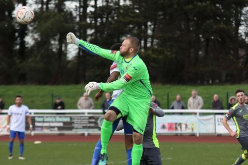 Havant keeper Ryan Young punches clear