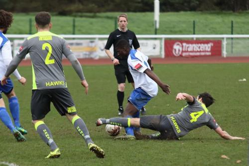 Havants Brian Stock (4) tackles Percy Kiangebeni
