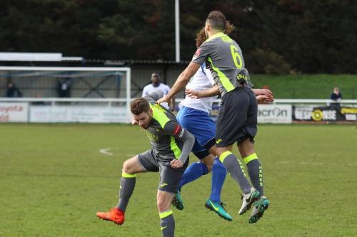 Havants Rory Williams (L) and Ed Harris challenge Harry Ottaway