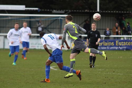 Havants Ryan Woodford (R) wins a header against Karl Oliyide