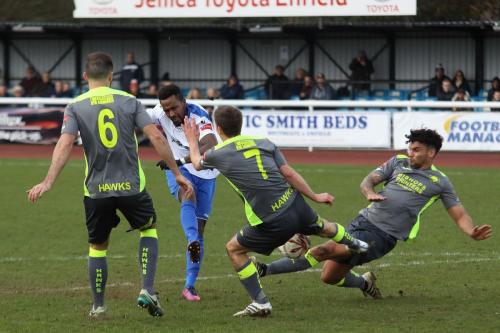Havants Theo Lewis (R) and Wes Fogden stretch to block Bobby Devynes shot