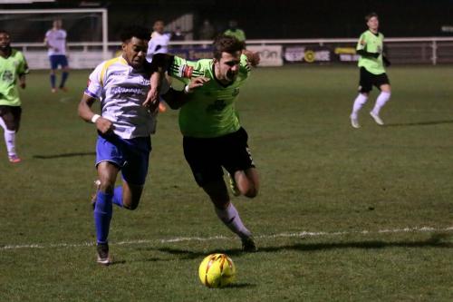 Enfields Dernell Wynter (L) and Hendons Luke Tingey challenge for possession