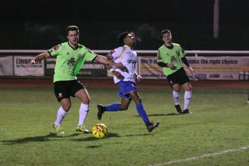 Enfields Dernell Wynter (centre) cant quite reach a cross