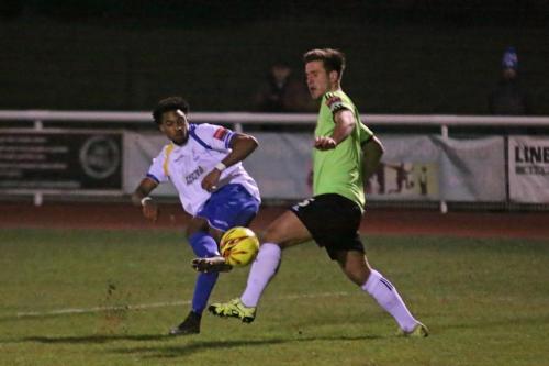 Enfields Dernell Wynter curls a shot from the edge of the area