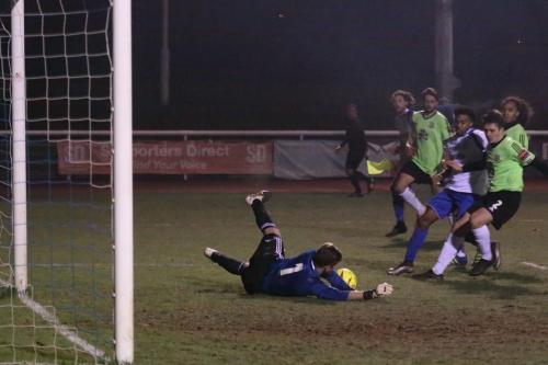 Hendons Tom Lovelock saves Harry Ottaways shot and makes sure Dernell Wynter cant reach the loose ball