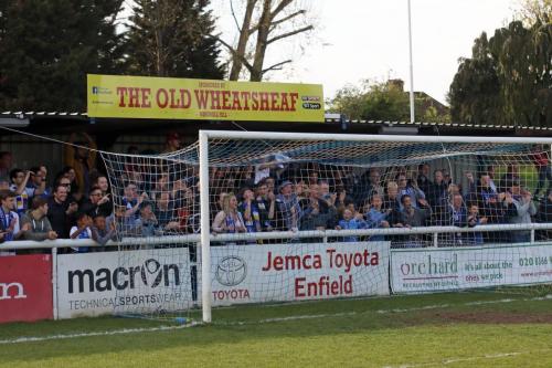 Enfield fans celebrate at the end of the game