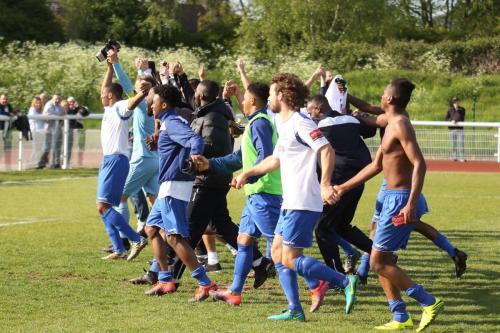 Enfield players salute the fans