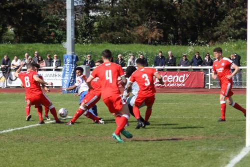 Enfields Dernell Wynter is crowded out by the Leiston defence