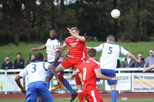 Enfields Harold Joseph wins a header against Armani Schaar (red)