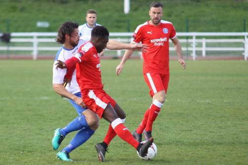 Enfields Harry Ottaway (L) challenges Ade Cole